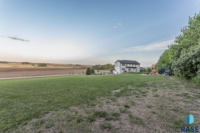 25265 466th Ave, Hartford, SD 57033 - view of grassy yard featuring a playground and a view of rural / pastoral area