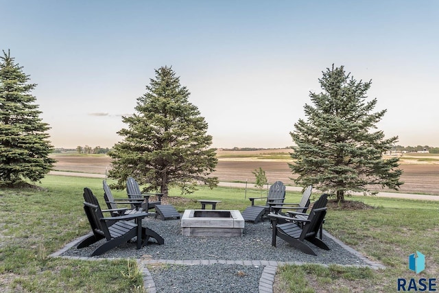25265 466th Ave, Hartford, SD 57033 - view of grassy yard featuring an outdoor fire pit and a view of rural / pastoral area