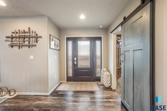 25265 466th Ave, Hartford, SD 57033 - foyer with a barn door, wood finished floors, baseboards, a textured ceiling, and recessed lighting