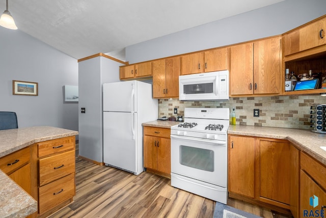 7200 S Hoffman Pl, Sioux Falls, SD 57108 - kitchen featuring white appliances, decorative backsplash, light countertops, and light wood finished floors