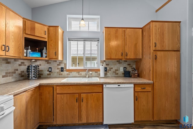 7200 S Hoffman Pl, Sioux Falls, SD 57108 - kitchen with white dishwasher, a sink, light countertops, backsplash, and high vaulted ceiling