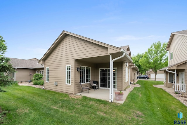 7200 S Hoffman Pl, Sioux Falls, SD 57108 - rear view of house with a patio and a lawn
