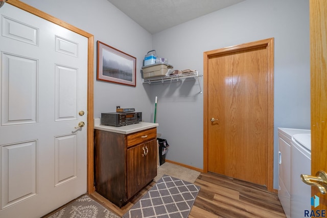 7200 S Hoffman Pl, Sioux Falls, SD 57108 - laundry room featuring washing machine and dryer and light wood-style floors
