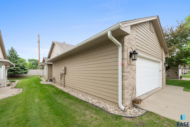 7200 S Hoffman Pl, Sioux Falls, SD 57108 - view of side of property with a garage, driveway, and brick siding