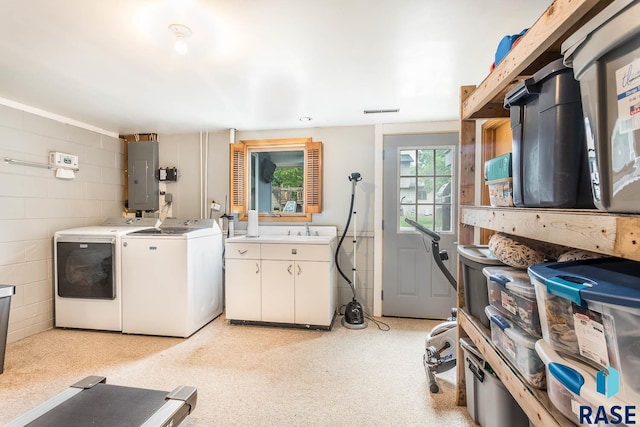 1002 N Carol St, Luverne, MN 56156 - laundry area with cabinet space, electric panel, and washer and clothes dryer