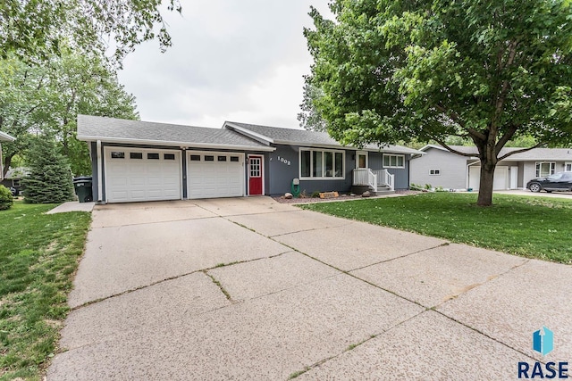 1002 N Carol St, Luverne, MN 56156 - single story home with an attached garage, a front yard, driveway, and a shingled roof