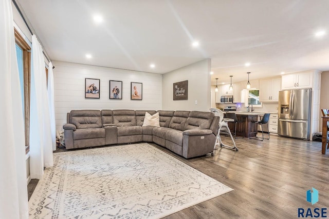 1002 N Carol St, Luverne, MN 56156 - living room with dark wood-type flooring and recessed lighting