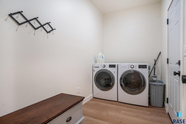110 Skyline Dr, Valley Springs, SD 57068 - clothes washing area with separate washer and dryer and light wood-style floors
