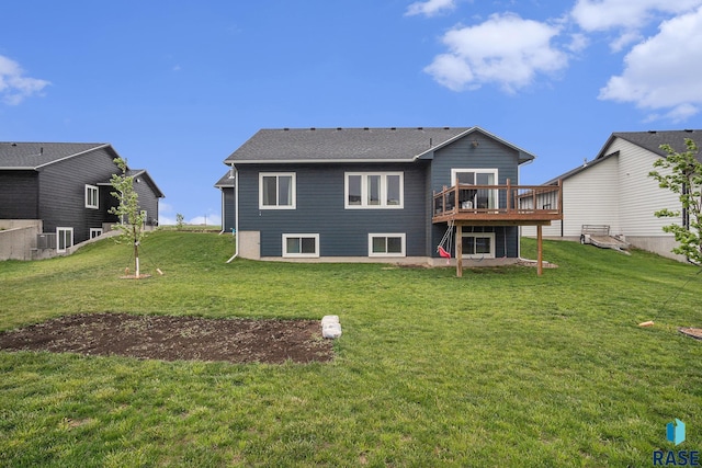 110 Skyline Dr, Valley Springs, SD 57068 - rear view of house featuring a deck and a yard
