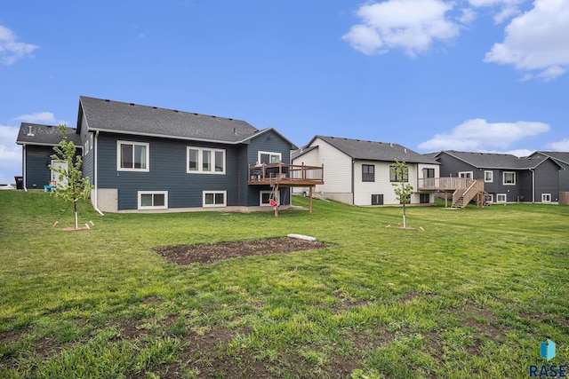 110 Skyline Dr, Valley Springs, SD 57068 - back of house with a deck, a residential view, and a lawn