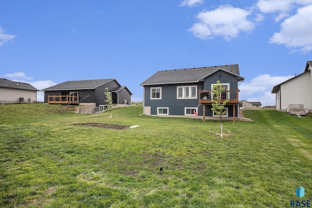 110 Skyline Dr, Valley Springs, SD 57068 - rear view of property with a deck and a yard