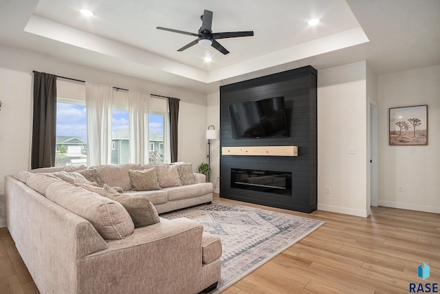 110 Skyline Dr, Valley Springs, SD 57068 - living room with a raised ceiling, light wood-type flooring, baseboards, a ceiling fan, and recessed lighting