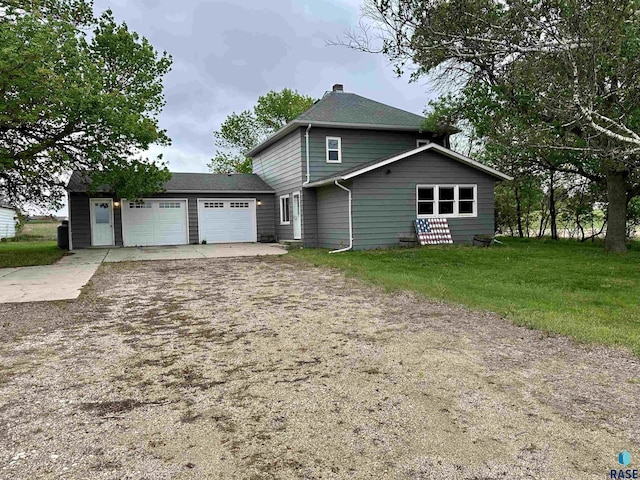 210 160th Ave, Edgerton, MN 56156 - view of front of home with a garage, driveway, a chimney, and a front lawn