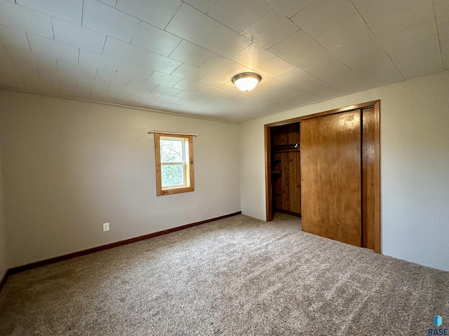 210 160th Ave, Edgerton, MN 56156 - unfurnished bedroom featuring carpet floors, a closet, and baseboards