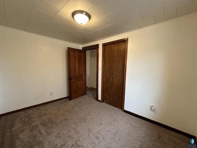 210 160th Ave, Edgerton, MN 56156 - unfurnished bedroom with carpet, baseboards, and a closet