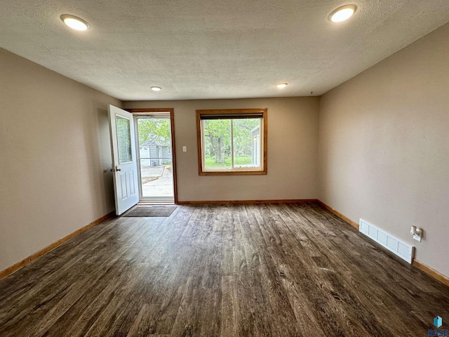 210 160th Ave, Edgerton, MN 56156 - spare room with dark wood-type flooring, baseboards, a textured ceiling, and recessed lighting