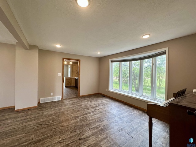 210 160th Ave, Edgerton, MN 56156 - empty room featuring baseboards, wood finished floors, recessed lighting, and a textured ceiling