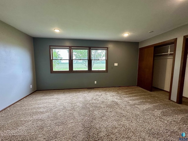 210 160th Ave, Edgerton, MN 56156 - unfurnished bedroom with carpet flooring and recessed lighting