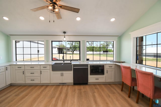 47138 293rd St, Beresford, SD 57004 - kitchen with a sink, light wood-type flooring, recessed lighting, light countertops, and plenty of natural light