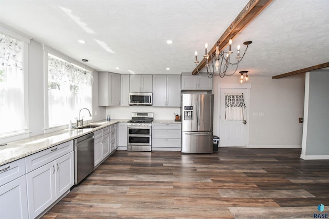 47138 293rd St, Beresford, SD 57004 - kitchen featuring stainless steel appliances, a sink, gray cabinets, recessed lighting, and light stone countertops