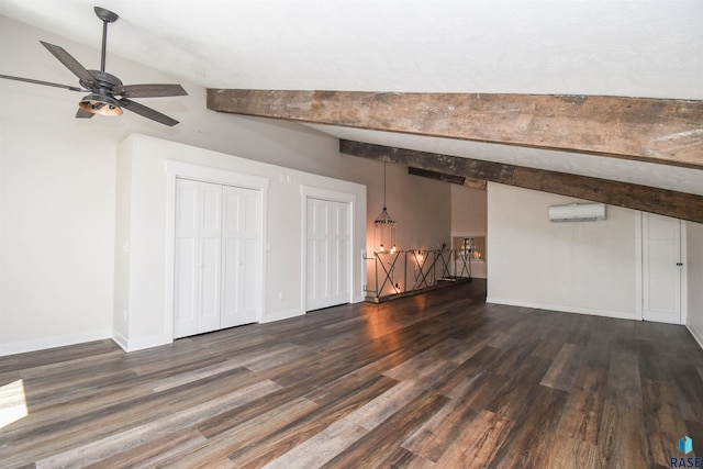 47138 293rd St, Beresford, SD 57004 - unfurnished living room with a wall unit AC, dark wood-style flooring, ceiling fan, and baseboards