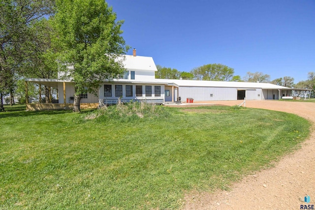 47138 293rd St, Beresford, SD 57004 - view of front facade featuring a front yard, a chimney, and dirt driveway