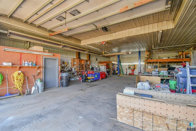 47138 293rd St, Beresford, SD 57004 - garage with a workshop area and a garage door opener