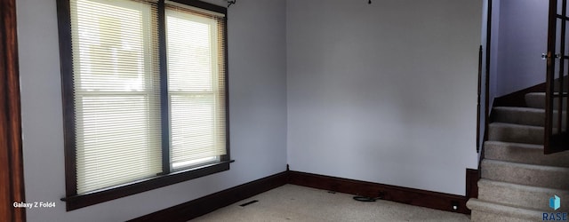 120 Main St, Scotland, SD 57059 - carpeted empty room with stairs and baseboards