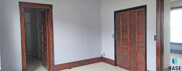 120 Main St, Scotland, SD 57059 - unfurnished bedroom with carpet, a closet, baseboards, and connected bathroom