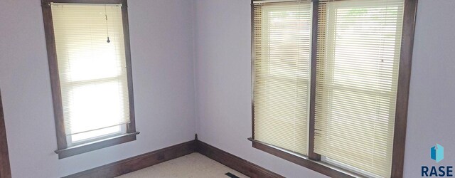 120 Main St, Scotland, SD 57059 - empty room with baseboards and plenty of natural light