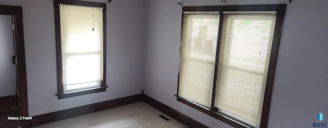 120 Main St, Scotland, SD 57059 - spare room with carpet flooring, baseboards, and healthy amount of natural light