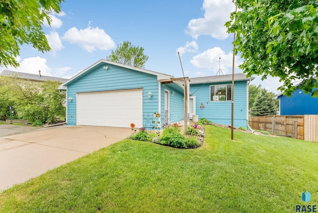 ranch-style home with concrete driveway and an attached garage