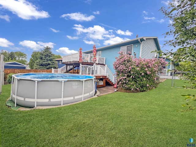 view of yard featuring stairway and a deck