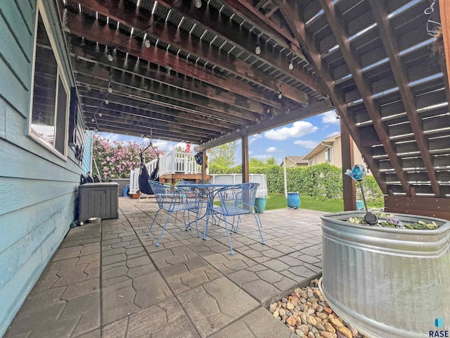 fenced backyard featuring outdoor dining area and a patio area