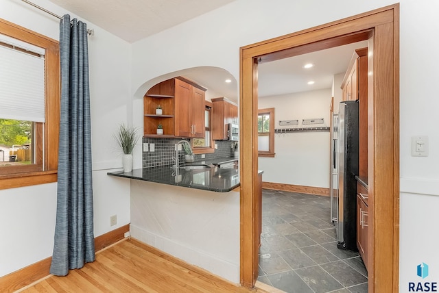 kitchen with baseboards, open shelves, a sink, tasteful backsplash, and recessed lighting