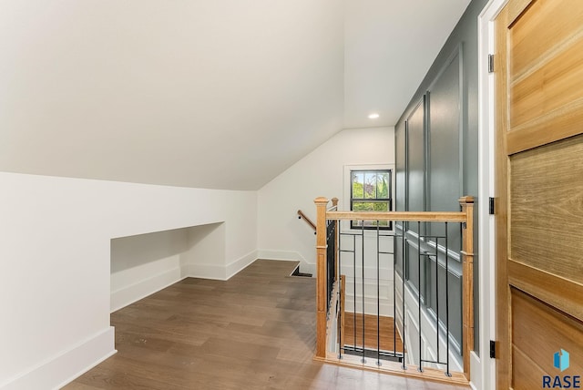 bonus room featuring baseboards, vaulted ceiling, dark wood finished floors, and recessed lighting