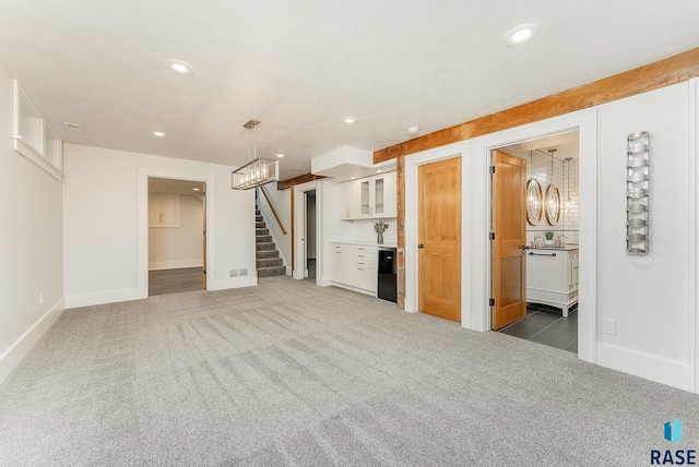basement with carpet flooring, recessed lighting, a chandelier, stairway, and baseboards