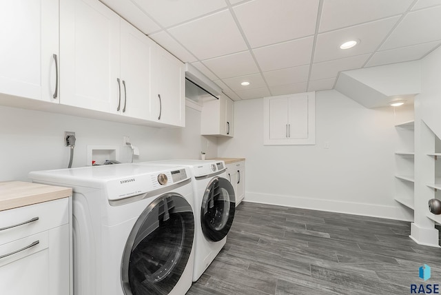 laundry area with washer and clothes dryer, cabinet space, baseboards, recessed lighting, and dark wood-style floors