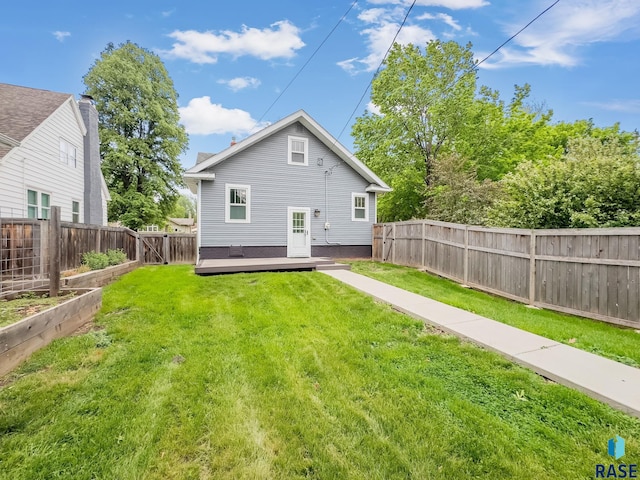 back of house featuring a deck