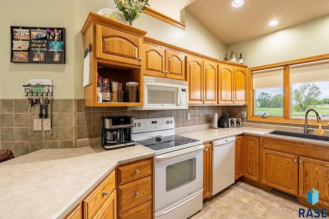 811 Southview Dr, Larchwood, IA 51241 - kitchen featuring white appliances, a sink, backsplash, light countertops, and recessed lighting