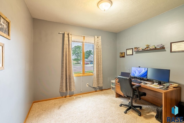 811 Southview Dr, Larchwood, IA 51241 - carpeted home office featuring baseboards and a textured ceiling