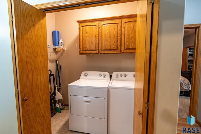 811 Southview Dr, Larchwood, IA 51241 - laundry area with cabinet space and independent washer and dryer