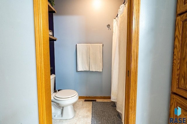 811 Southview Dr, Larchwood, IA 51241 - full bath with toilet and tile patterned floors