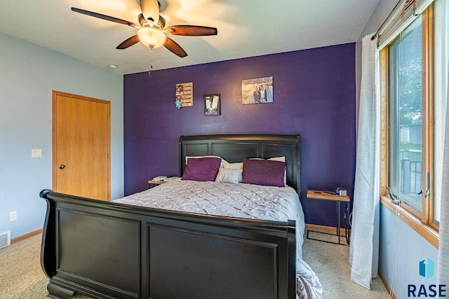 811 Southview Dr, Larchwood, IA 51241 - carpeted bedroom with baseboards and a ceiling fan