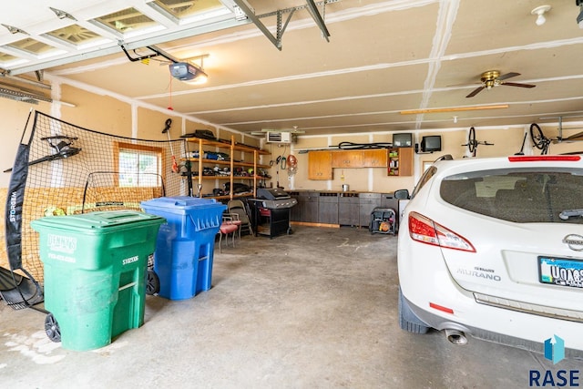 811 Southview Dr, Larchwood, IA 51241 - garage featuring a garage door opener