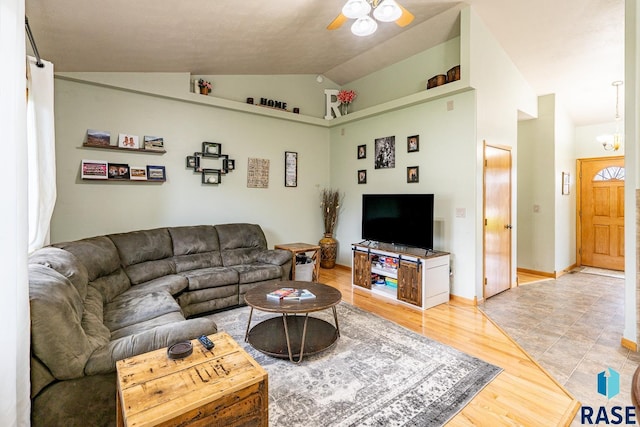 811 Southview Dr, Larchwood, IA 51241 - living room with lofted ceiling, ceiling fan, and light wood-style floors