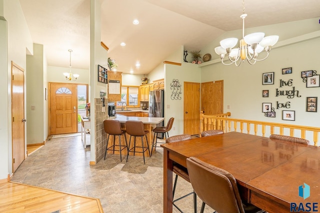 811 Southview Dr, Larchwood, IA 51241 - dining room with a chandelier and vaulted ceiling