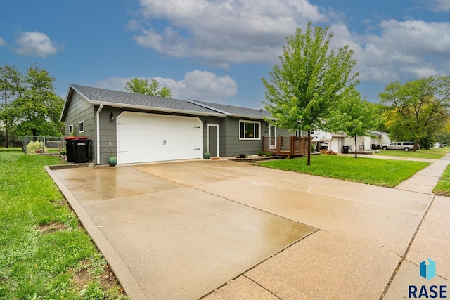 single story home with a garage, driveway, and a shingled roof