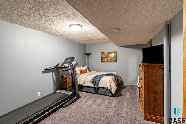 carpeted bedroom with a textured ceiling
