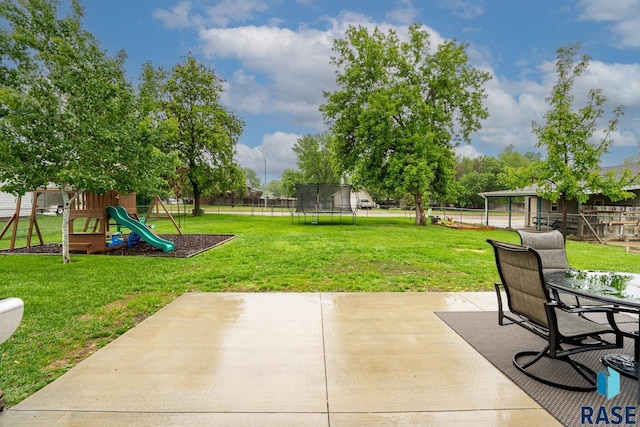 view of patio / terrace with a trampoline and a playground